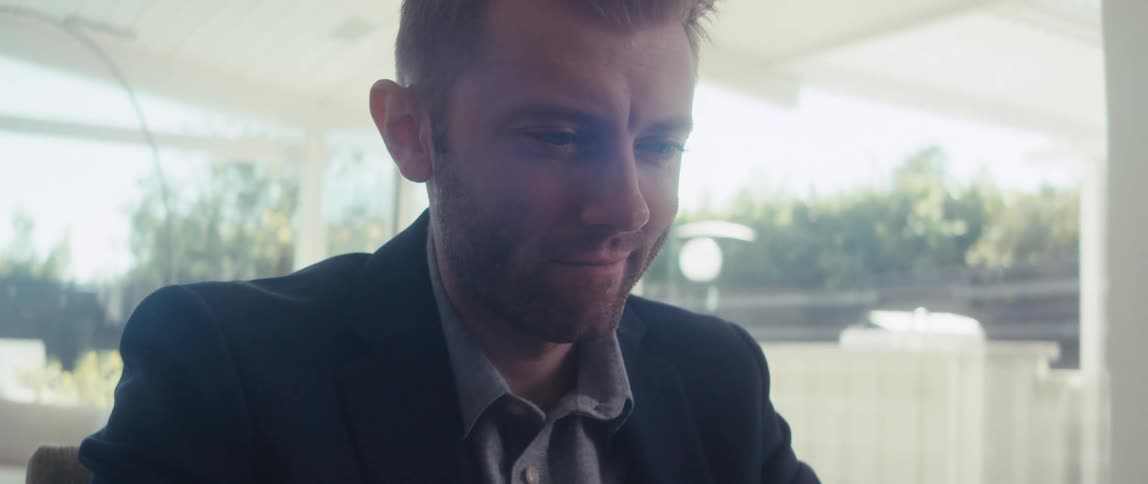 Man sitting focused in front of a laptop