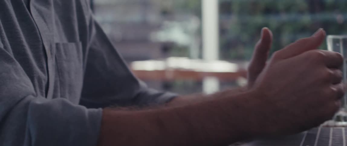 Man sitting in a virtual meeting via laptop
