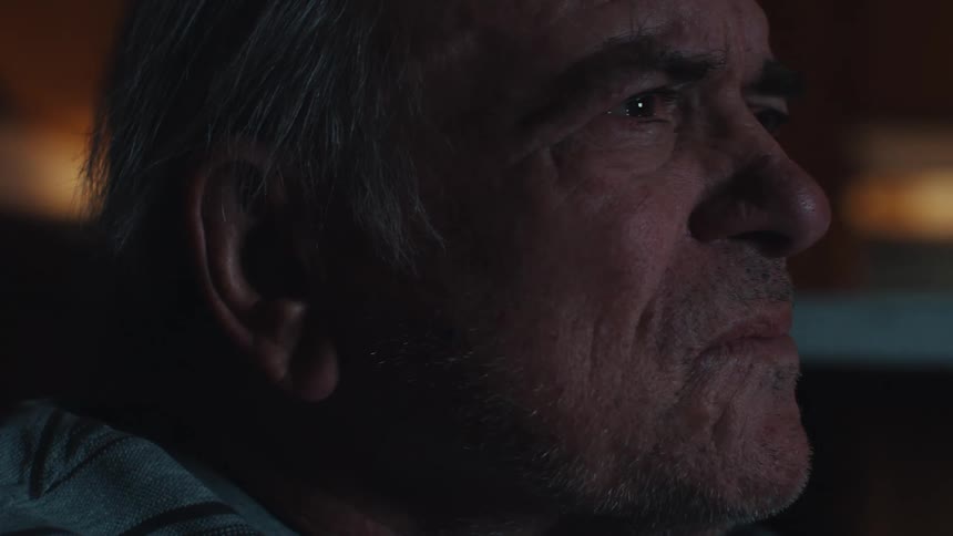 Side portrait of an elderly man staring straight ahead