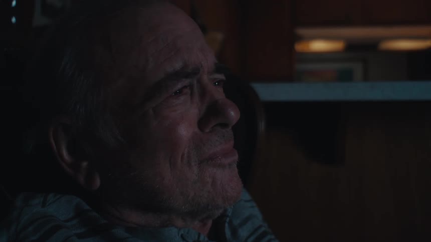 A clip of an elderly person crying