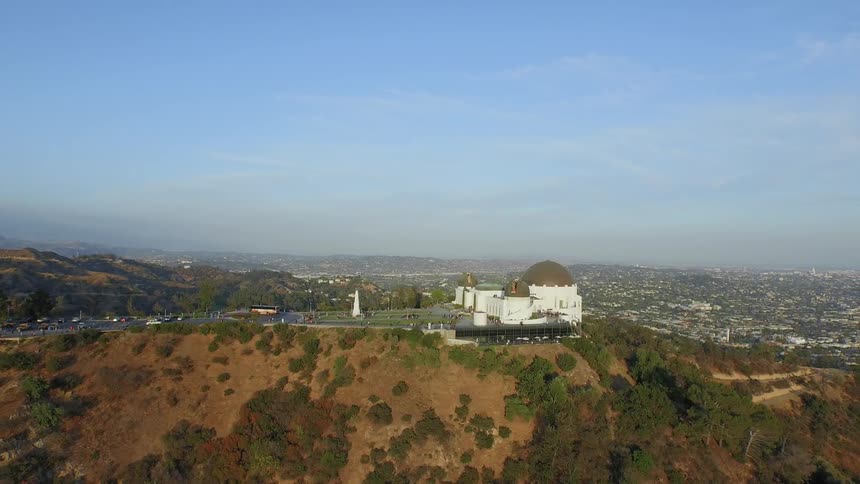 View of a building on a plateau overlooking a large city