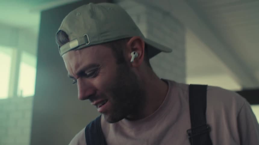 Man with airpods listening to music and enjoying