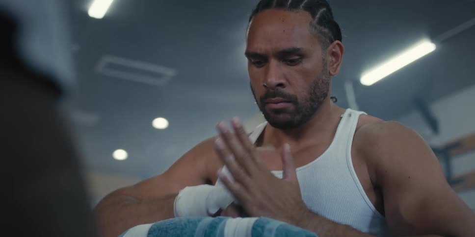 Boxer testing the bandage wrapped around his hands