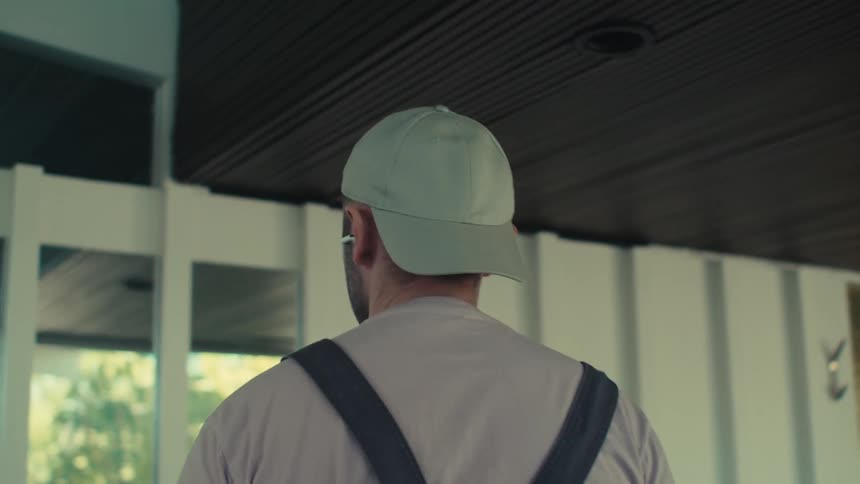 Man in cap listening to music and enjoying the vibe