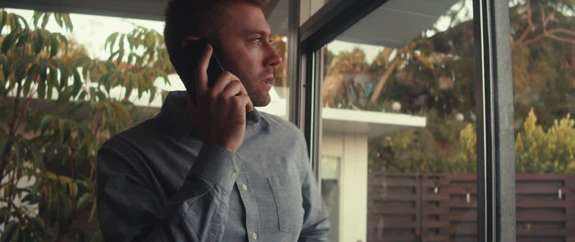 A man is having a conversation on his cell phone