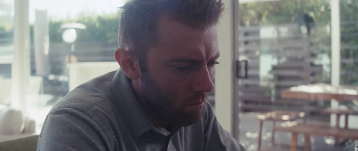 Portrait of a man with an angry facial expression looking to the side
