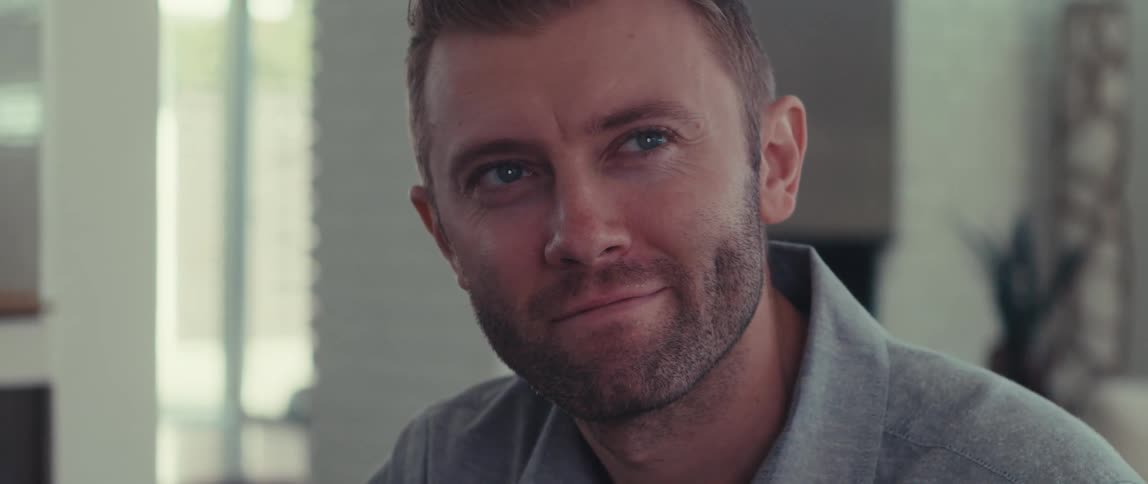 Portrait of a man with a happy facial expression while sitting indoors