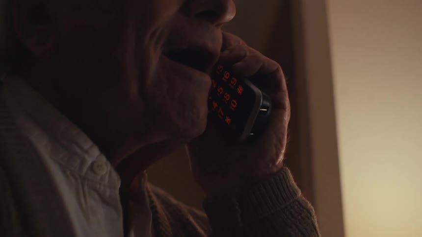 An image of an elderly man on a call