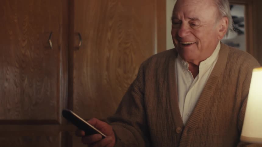 A man enters the room and answers the phone