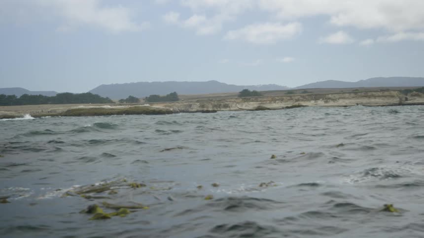 A large body of water that is real wavy and choppy