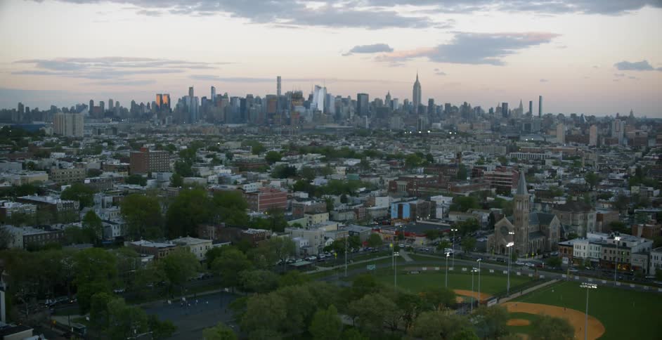 Aerial view of the suburbs of a large city heading towards downtown