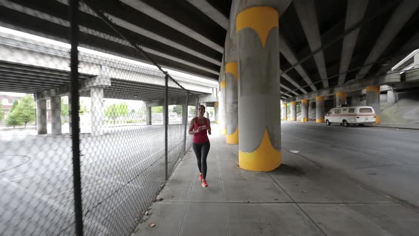 A woman running through a city