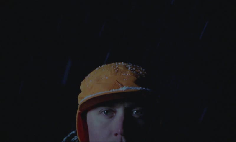 Portrait of a man outdoors at night on a snowy day