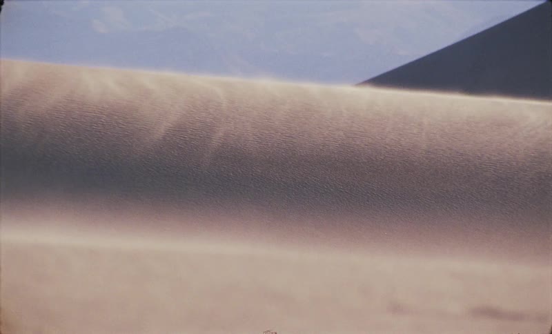 Desert dune scene with gently moving sand