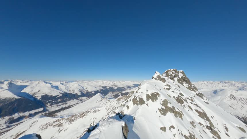 The peak gave a range of snowcapped mountains in contrast to the blue sky
