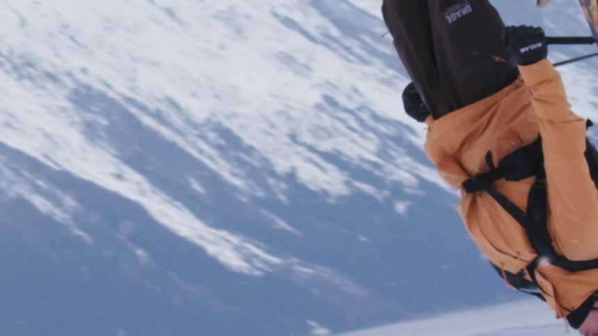 Person skiing and being in midair in an aerial maneuver