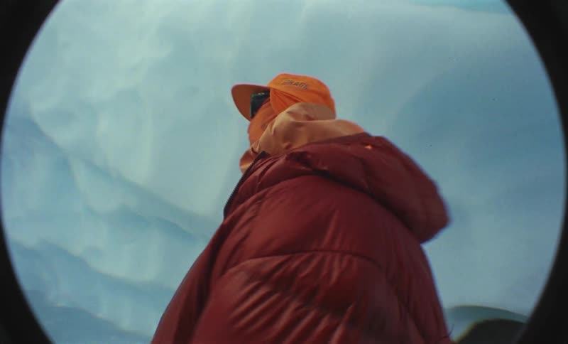 A portrait clip of a person in an ice cave