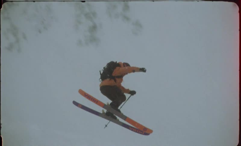 Person doing a radical aerial maneuver while skiing in the snow