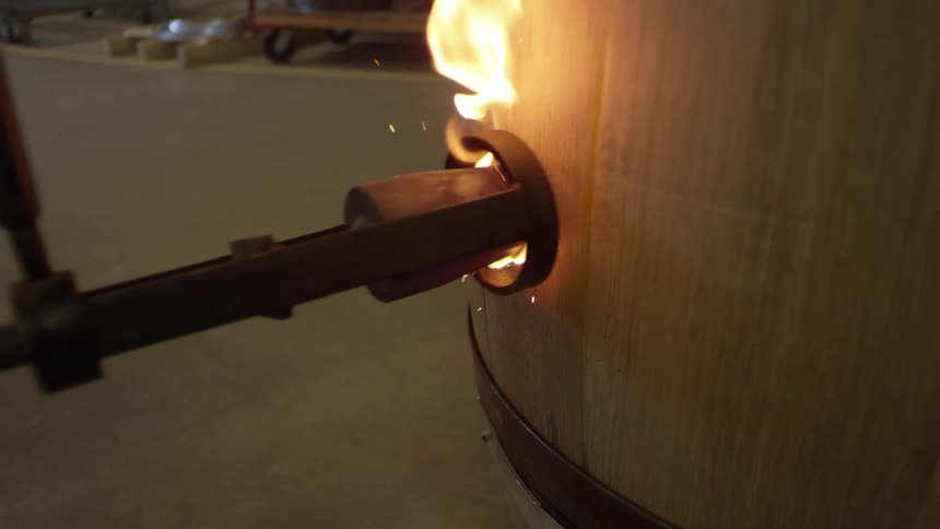 Tool with fire placed inside a wooden barrel