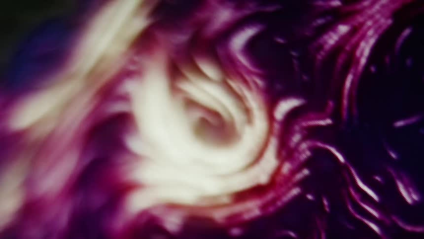 A screen shows yellow and purple lights flowing in various directions