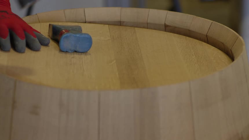 A clip of a person creating a wood craft