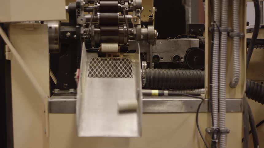 Machine in a factory pouring corks