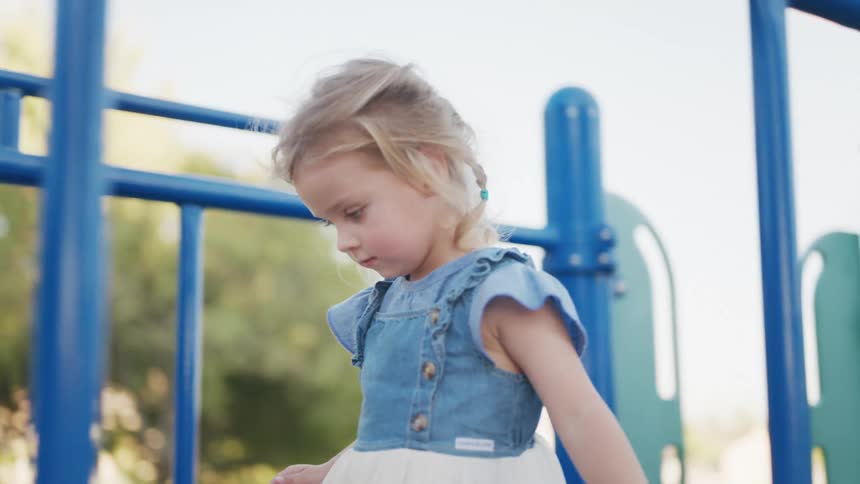A clip of a girl playing at the park