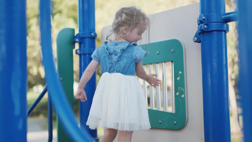 An image of a girl playing at the park