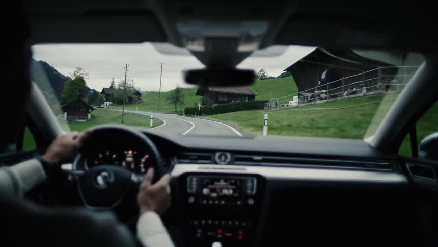 Person driving a vehicle on mountain roads