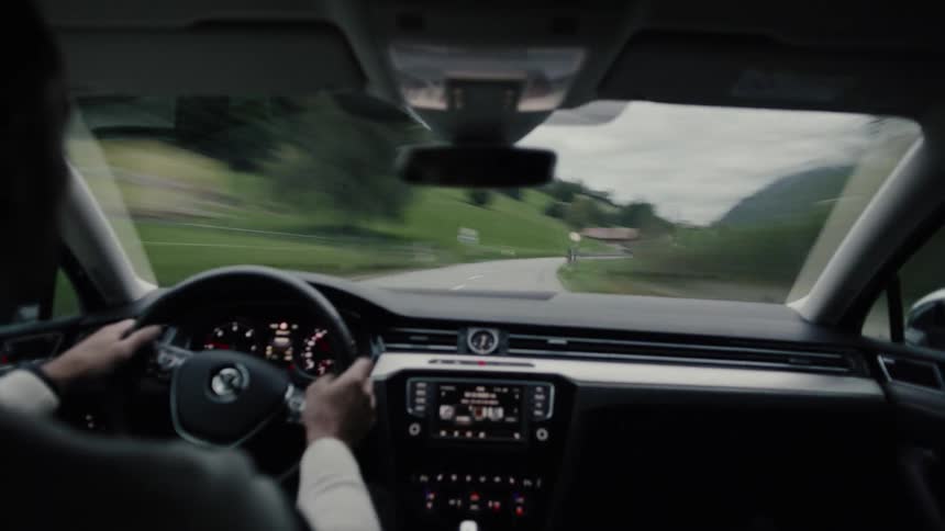 Dashboard of a vehicle with a person driving