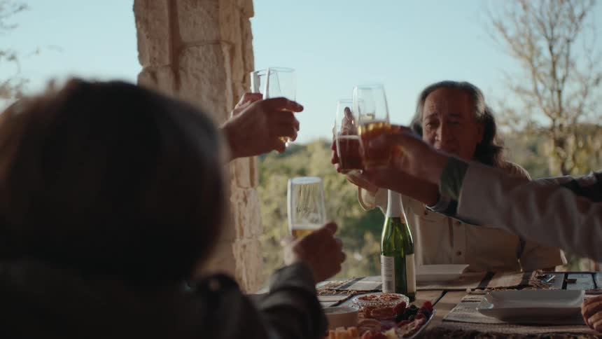 A clip of elderly people having a toast al fresco