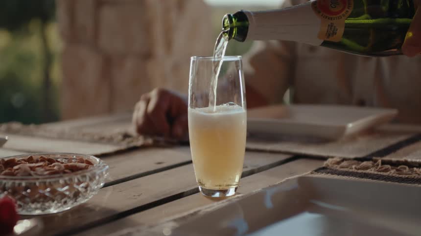 A clip of a person pouring a wine