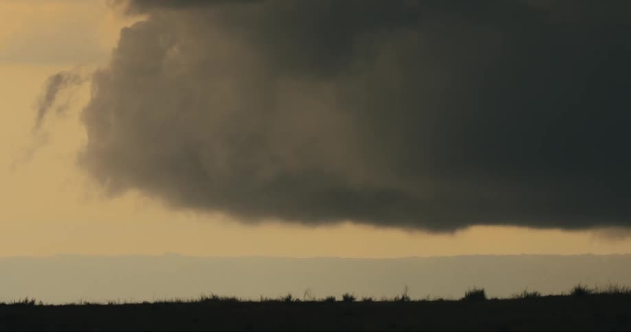 Natural landscape in the late afternoon with the sky with a large storm cloud