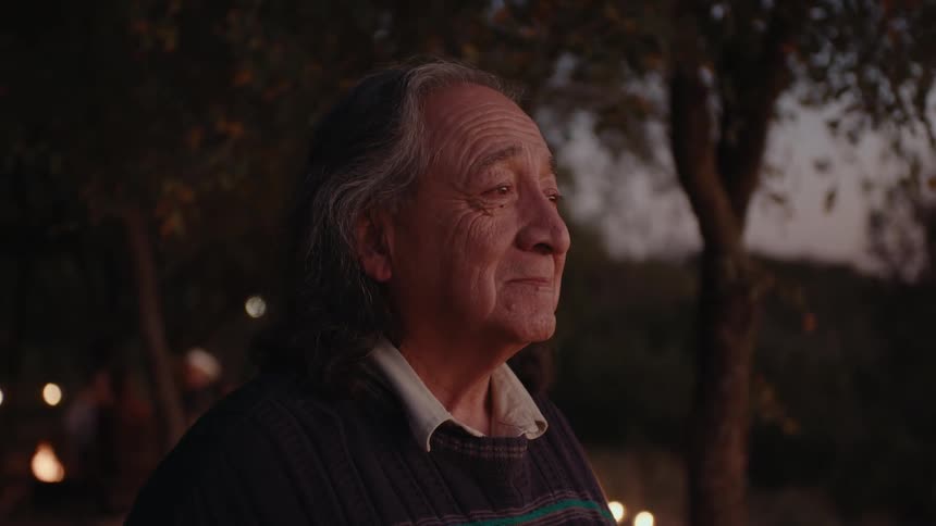 A clip of an elderly Native American lost in his own thoughts