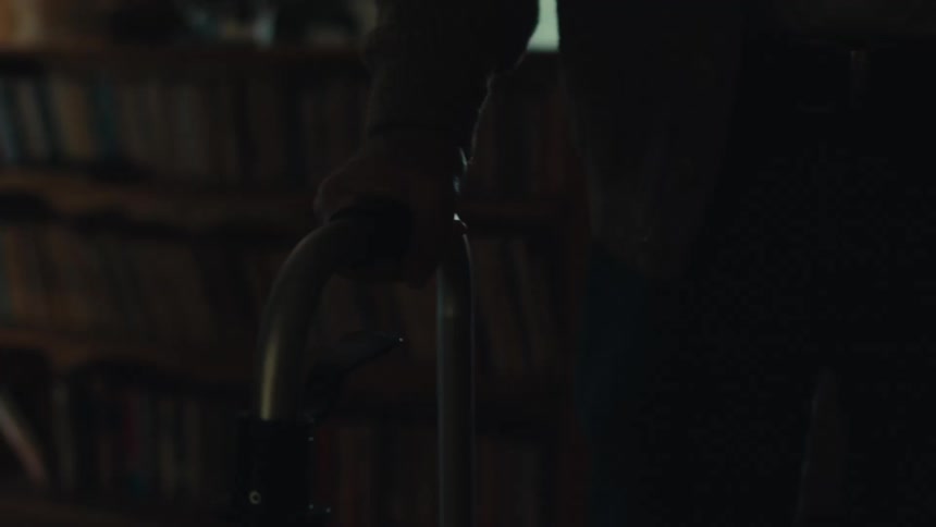 Hands of a person walking with the help of a walker
