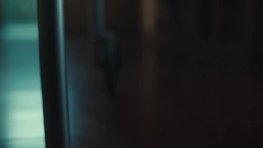 Closeup of a persons legs walking with the help of a walker
