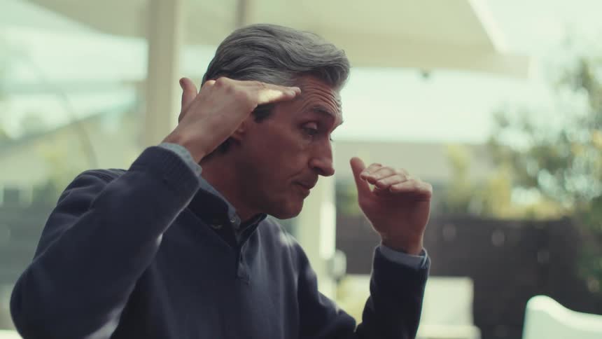 A clip of a person using hand gesture while having a conversation