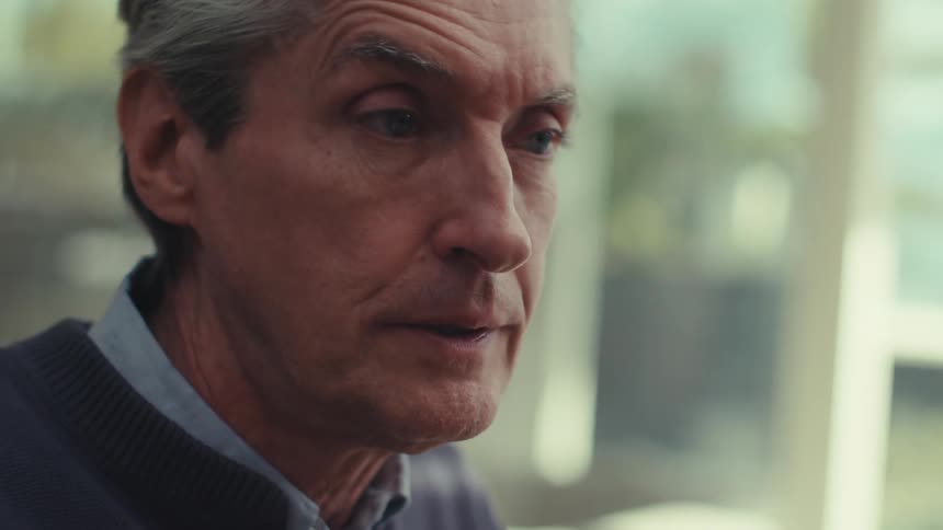 Portrait of a man sitting outside talking