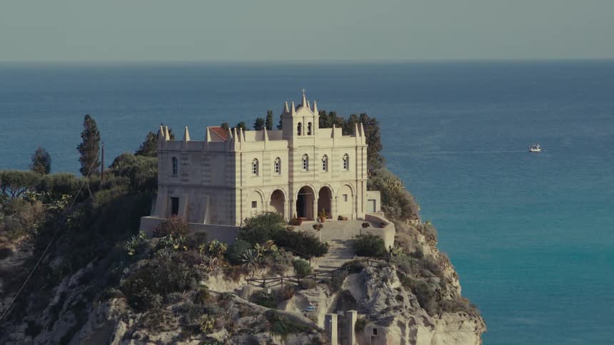 A clip of a castle on top of a rock