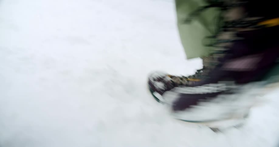 A person is walking through the snow