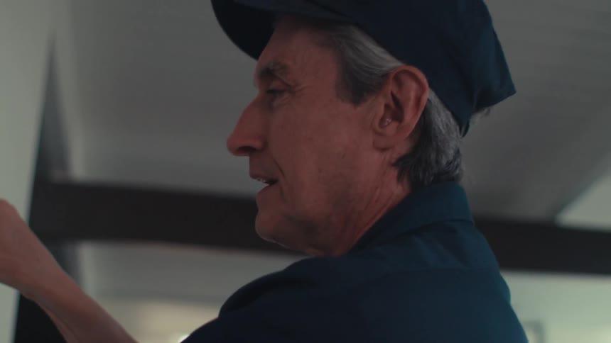 A clip of a person doing a repair indoor
