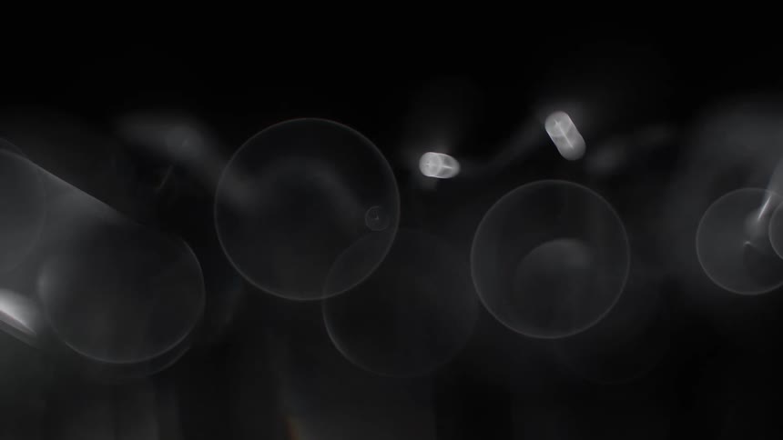 Metal object reflects light creating transparent disks
