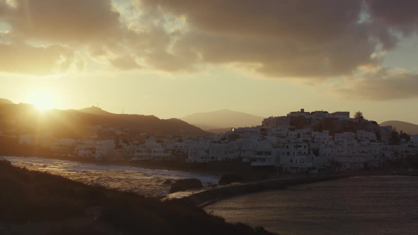 Sunset view over a coastal village with soft golden light