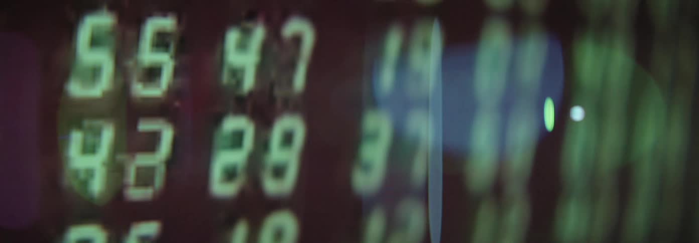 Closeup of rows of numbers changing on a computer screen