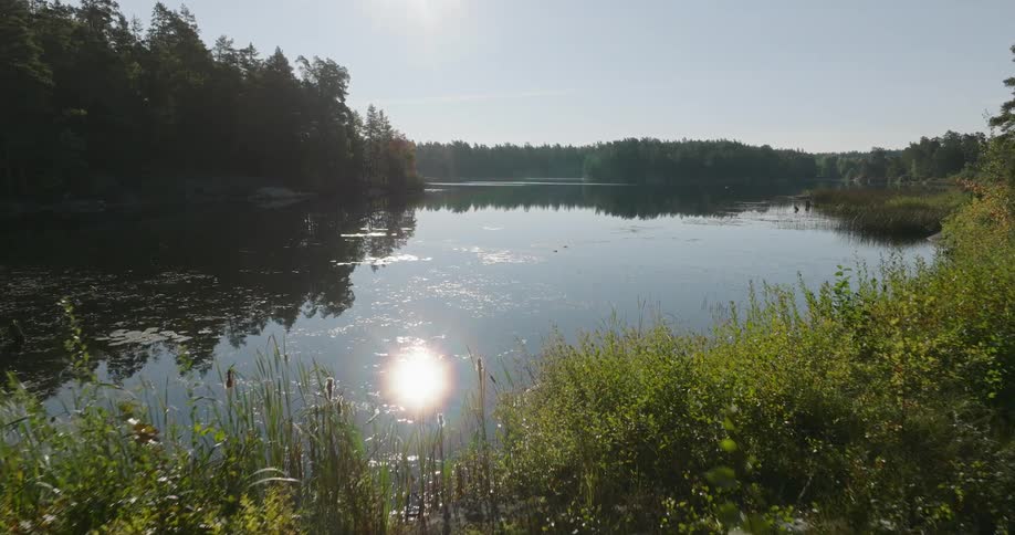The sun is reflecting on the lake water