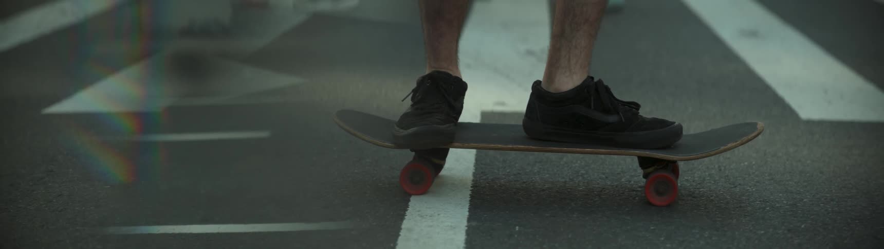 A man is riding a skateboard
