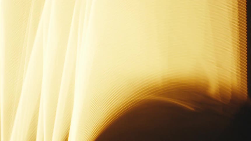 Bright strands of light contrast with the dark surroundings