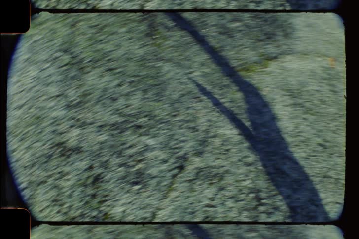 Film strip style video shows a person from the waist down running up a hill