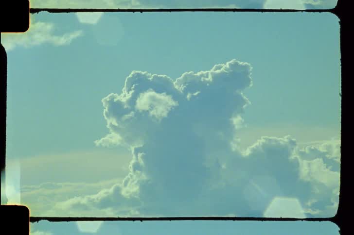 Puffy white clouds captured against a serene blue sky