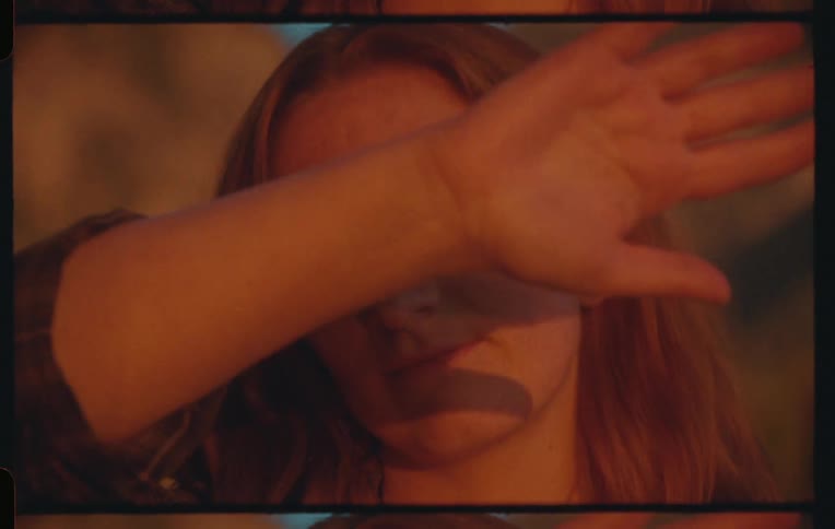 A clip of a lady waving her hands